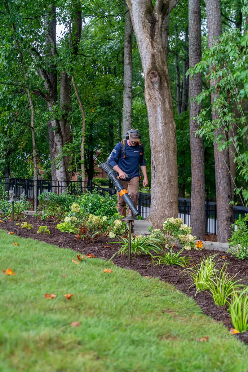 KalKare landscaper working in a garden bed